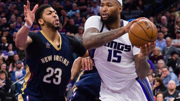 Feb 12, 2017; Sacramento, CA, USA; Sacramento Kings forward DeMarcus Cousins (15) passes the ball against New Orleans Pelicans forward Anthony Davis (23) during the fourth quarter at Golden 1 Center. The Sacramento Kings defeated the New Orleans Pelicans 105-99. Mandatory Credit: Kelley L Cox-USA TODAY Sports
